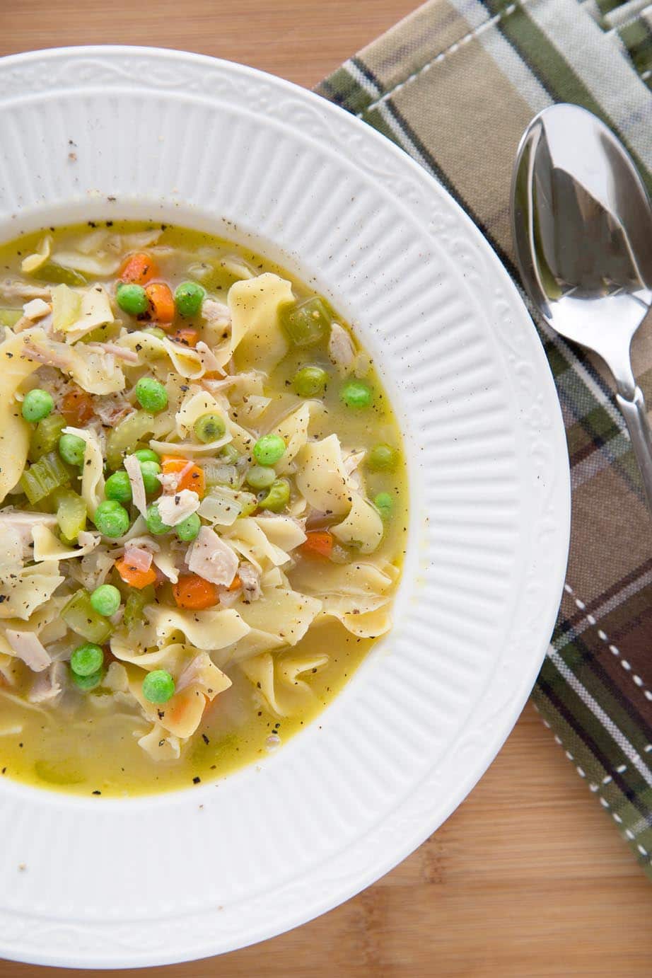 Bowl full of turkey noodle soup.