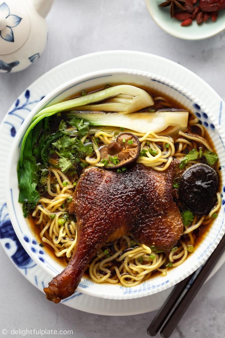 Vietnamese duck noodle soup in a decorative bowl.