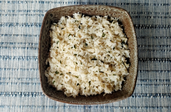 Herbed butter garlic rice in a bowl.