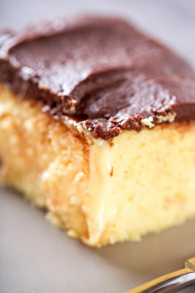 Slice of Boston cream poke cake.