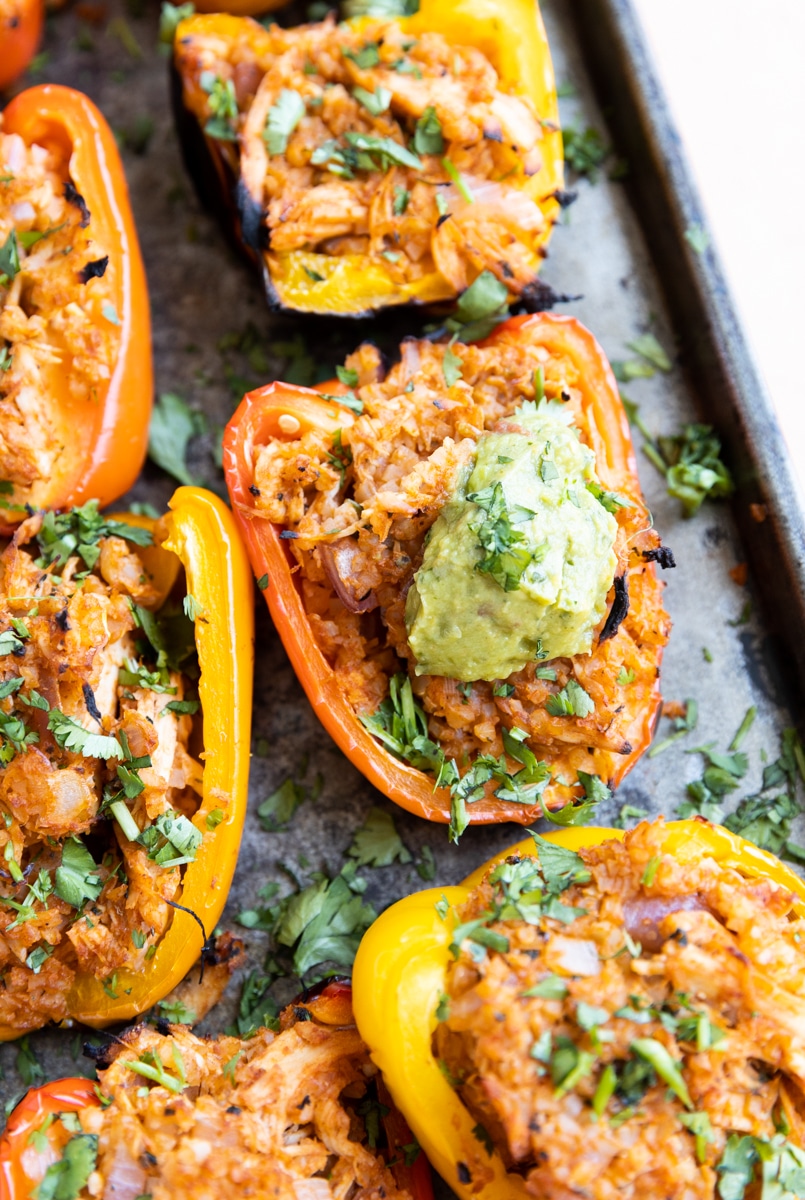 BBQ chicken grilled stuffed peppers on baking sheet.