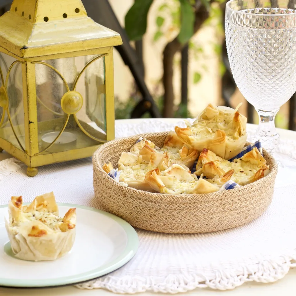 Mini filo quiches in a basket and on a plate.