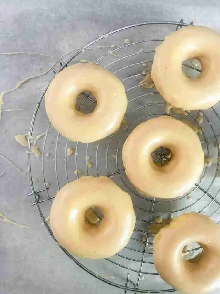 Baked mochi donuts on baking rack.
