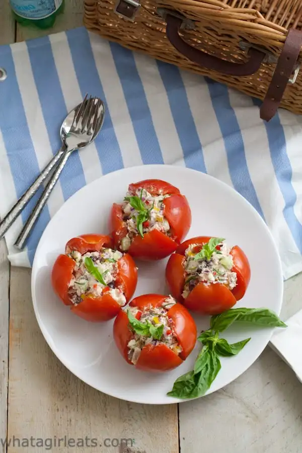 Greek tuna salad served in a whole tomato.