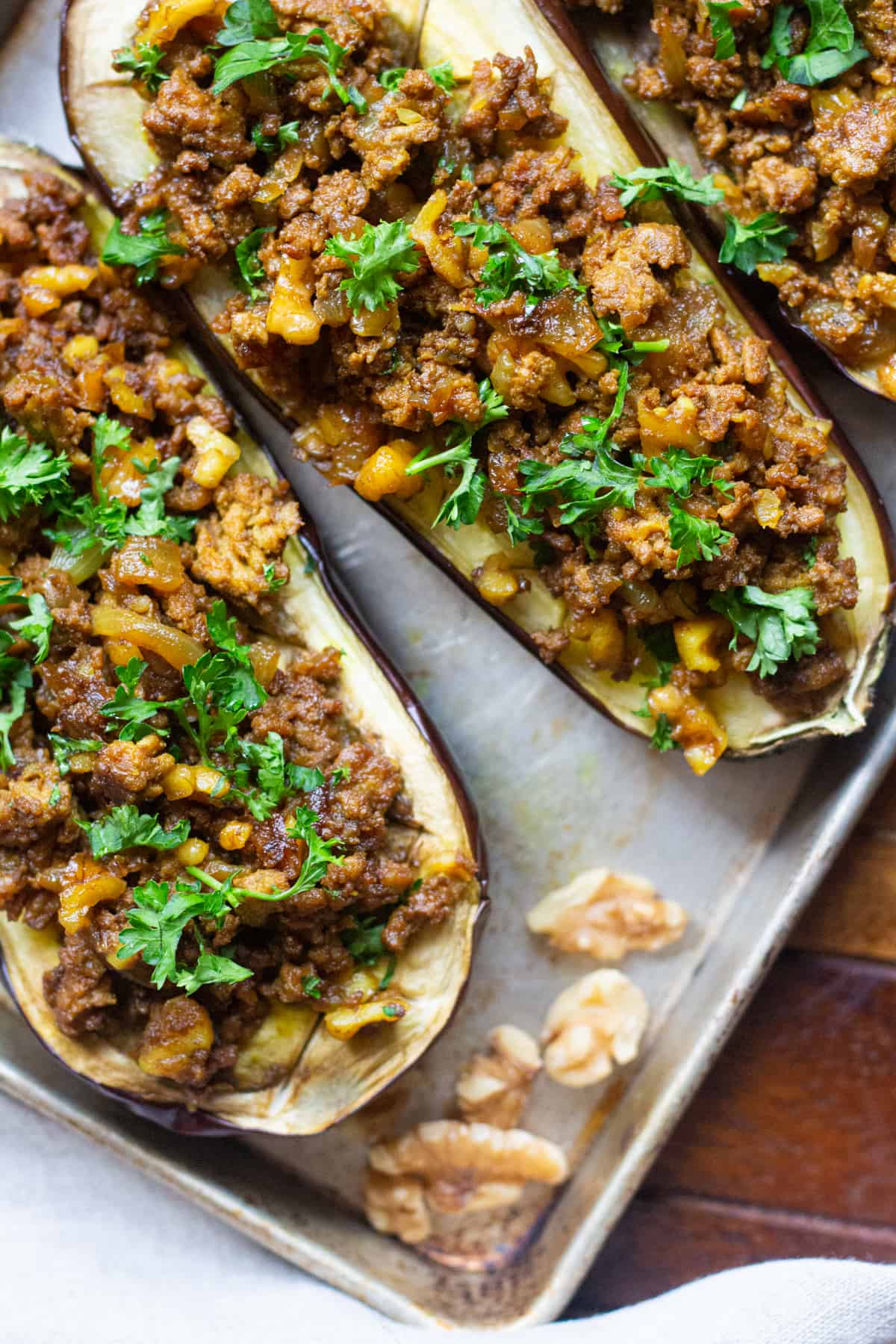 Seasoned lamb and walnut mixture inside eggplant.