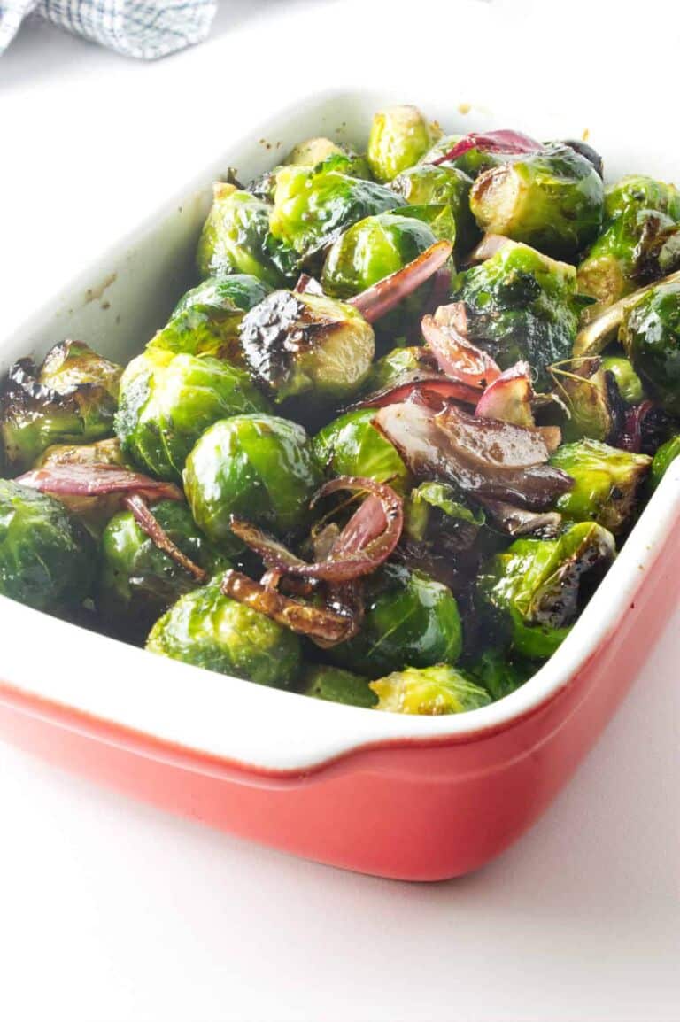 Longhorn Brussels sprouts in a red baking pan.