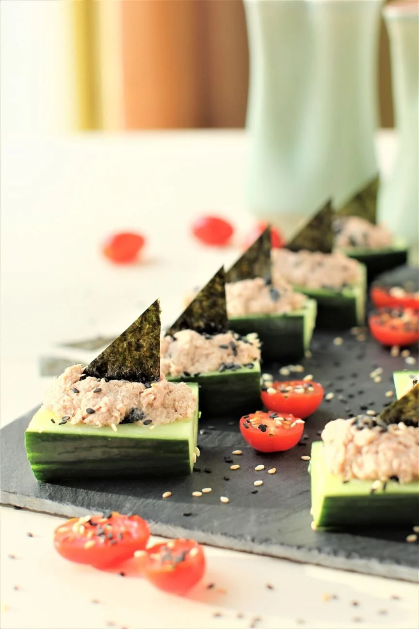 Wasabi tuna boats on a black slate plate.