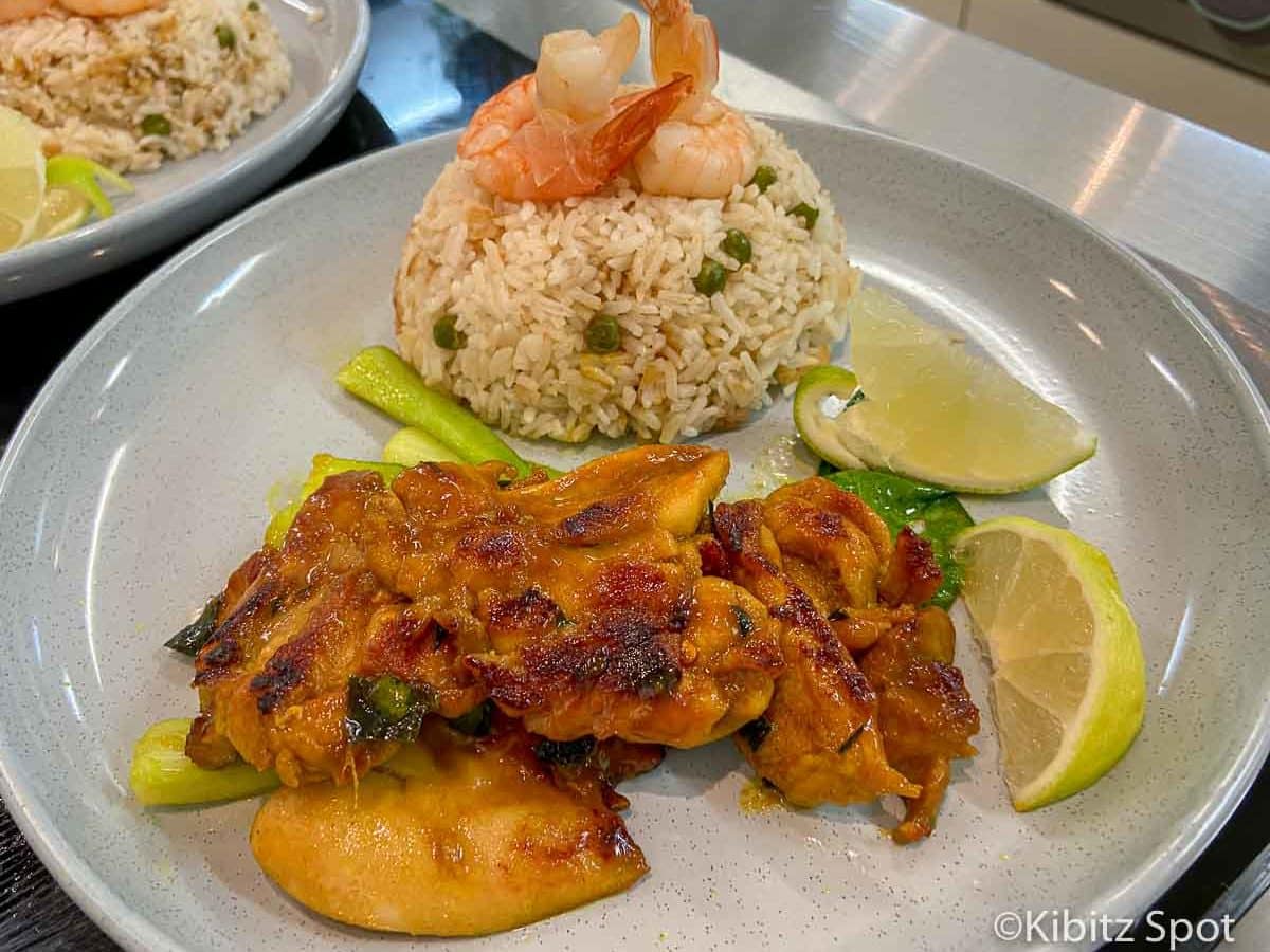 Vietnamese grilled chicken with kaffir lime and rice on a plate.