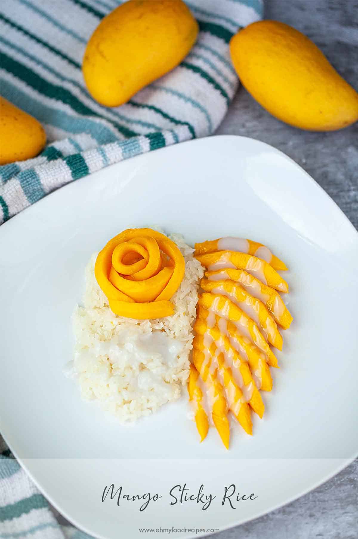 Thai sticky rice on a white plate with mango.