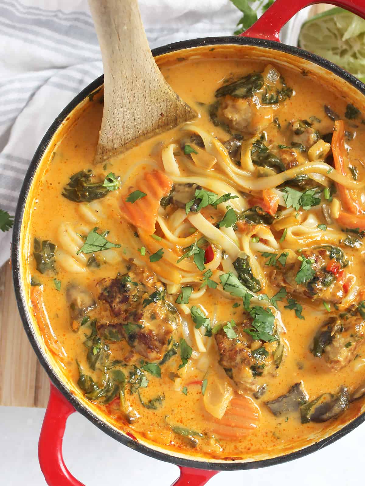 Thai meatball soup with rice noodles in a Dutch oven.