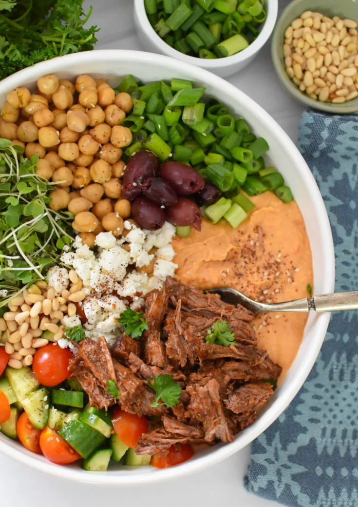 Slow cooker beef hummus bowls with olives, chick peas, feta, etc.