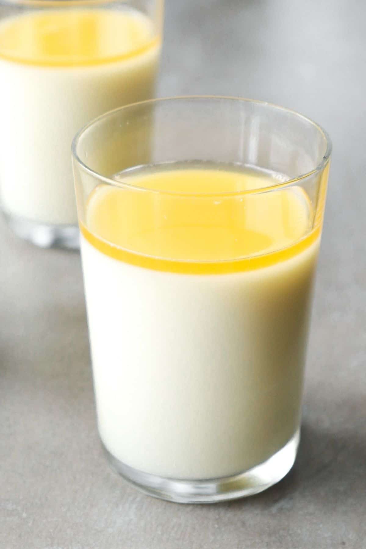 Lemon panna cotta in a glass cup.