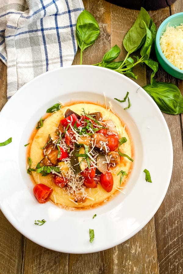 Easy slow cooker ratatouille over polenta in a bowl.