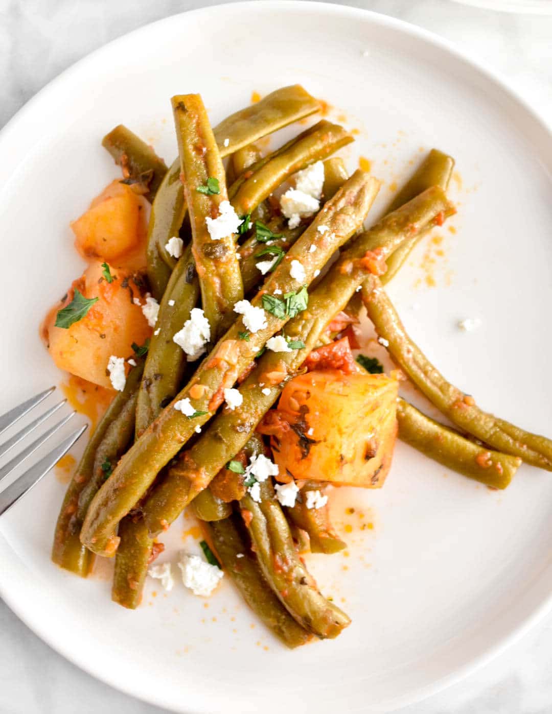 Fasolakia, Greek slow cooker green beans, on a plate.