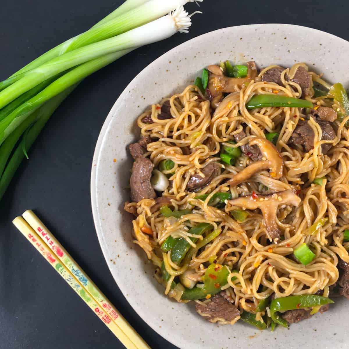 Beef yakisoba recipe with skirt steak and sliced bell peppers.