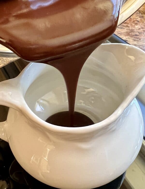 Easy chocolate sauce poured into a spouted container. 