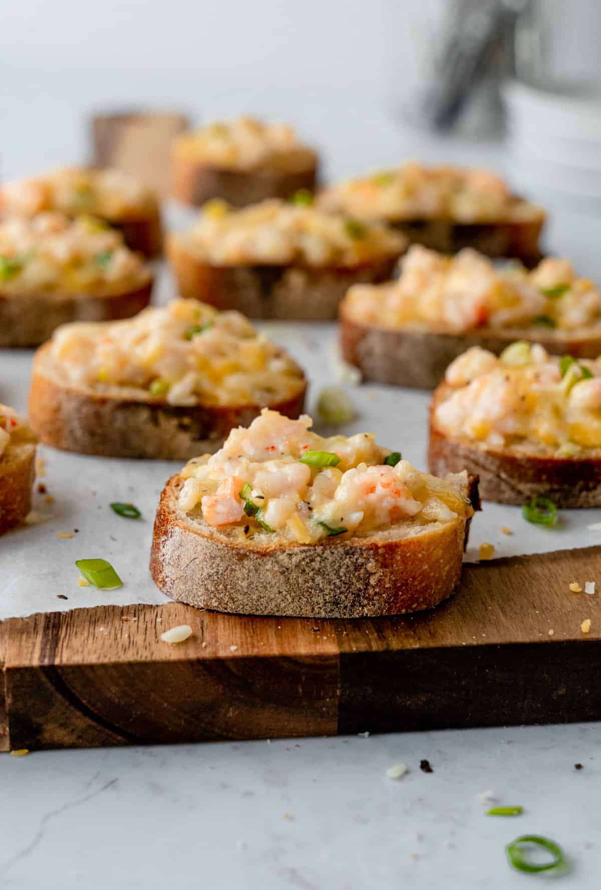 Vietnamese shrimp toast on a wooden board.