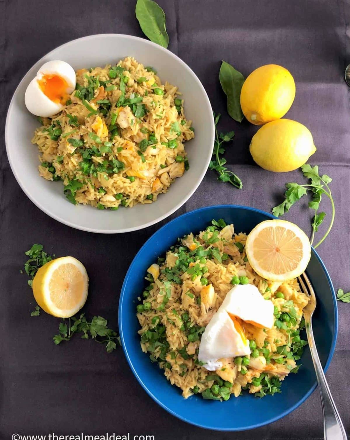 Smoked haddock kedgeree with poached eggs on a plate.