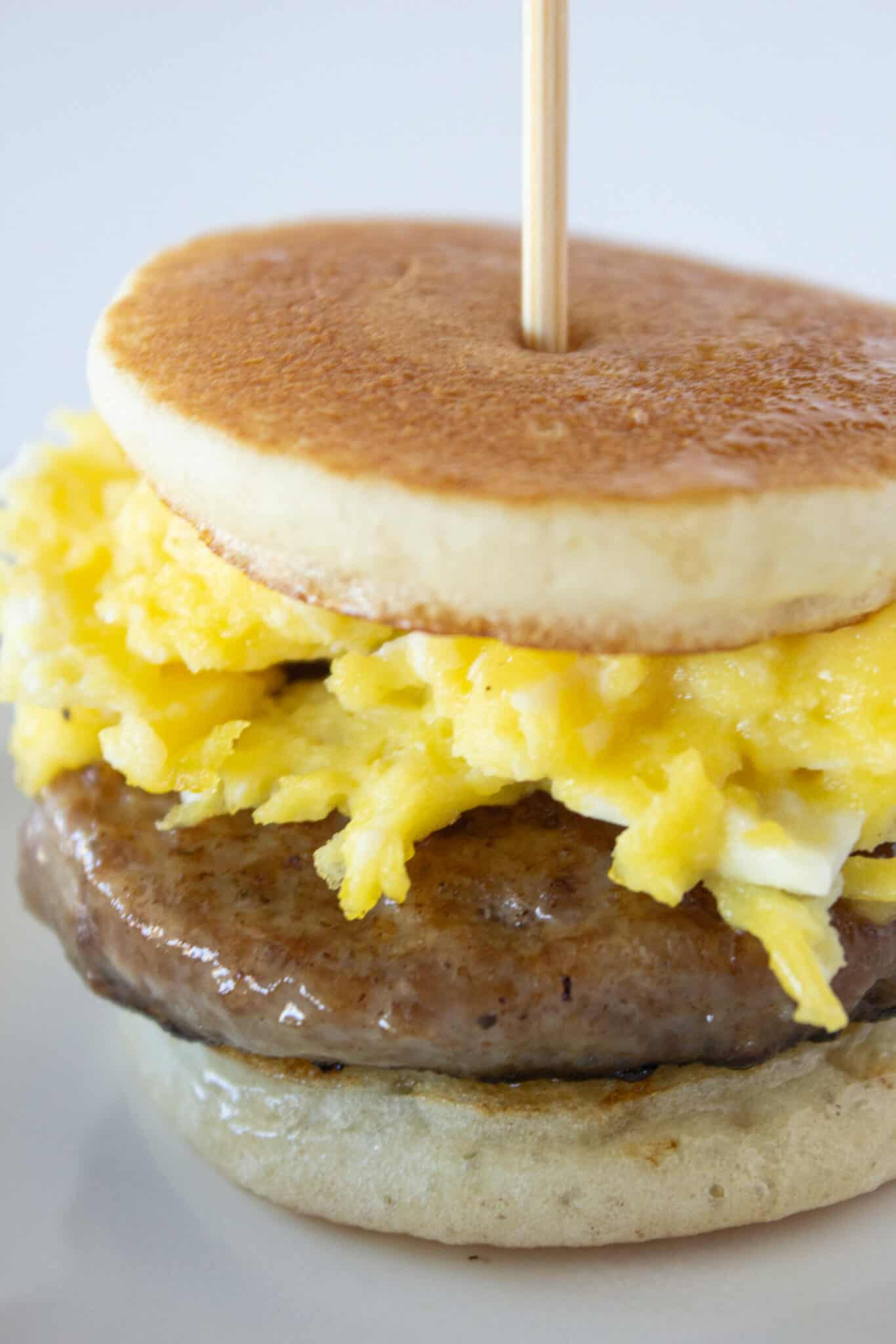 Pancake, sausage and egg slider on a skewer.