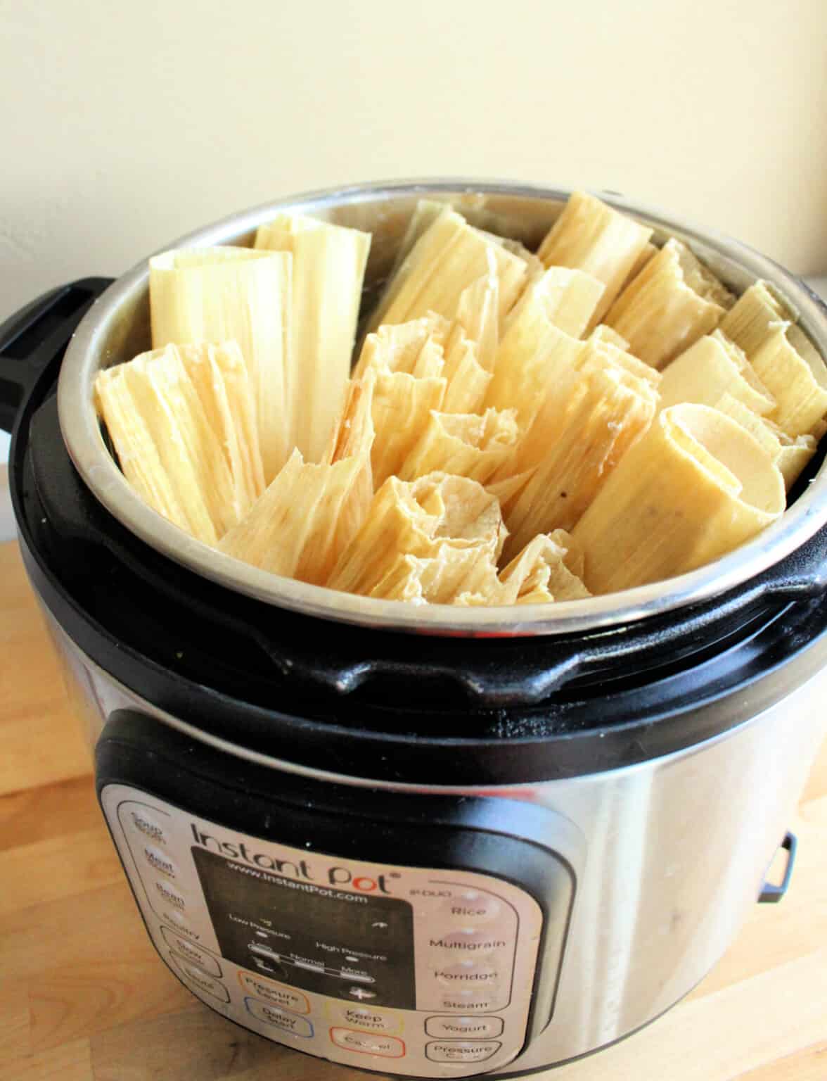 Instant pot chicken tamales in a pot.