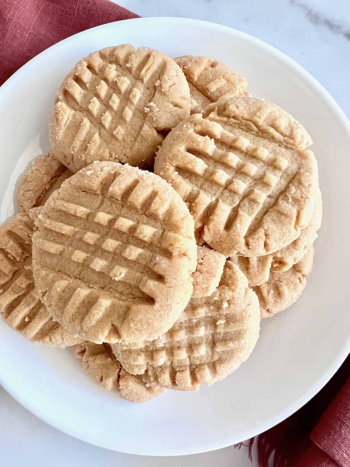 Small batch peanut butter cookies on a white plate.