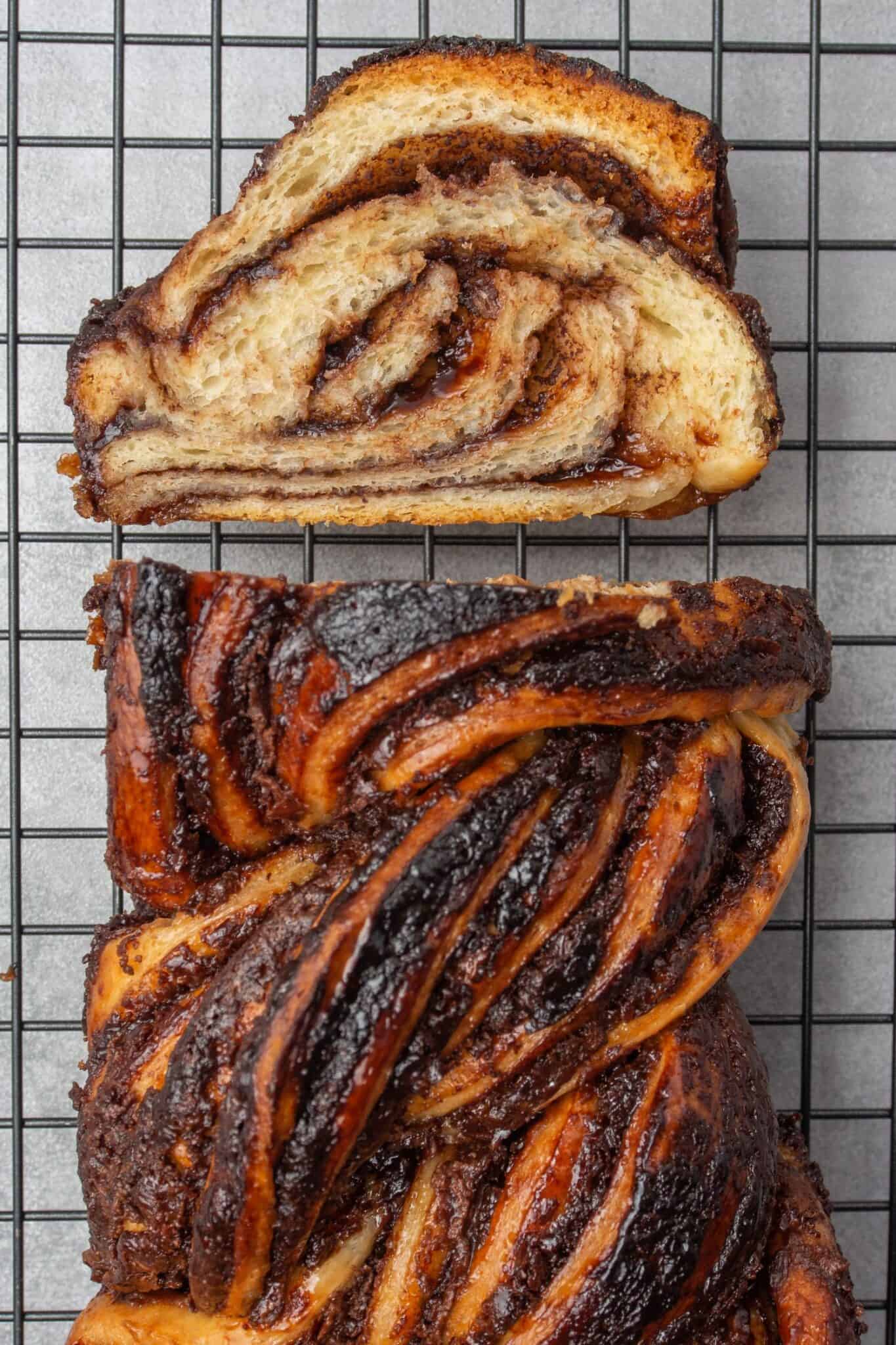 Sliced apple babka on a cooling rack.