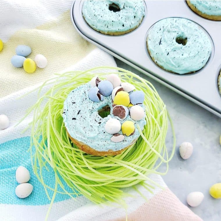 Whiskey speckled Easter donuts in a baking pan.