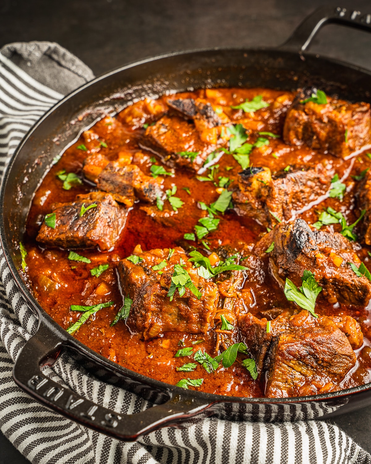 Beer braised short ribs in a pan.