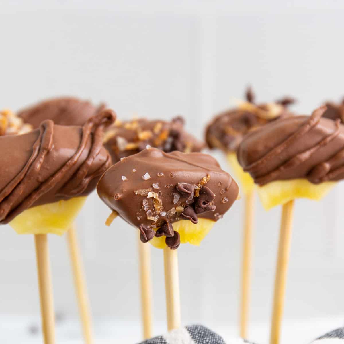 Chocolate covered pineapple on a stick.