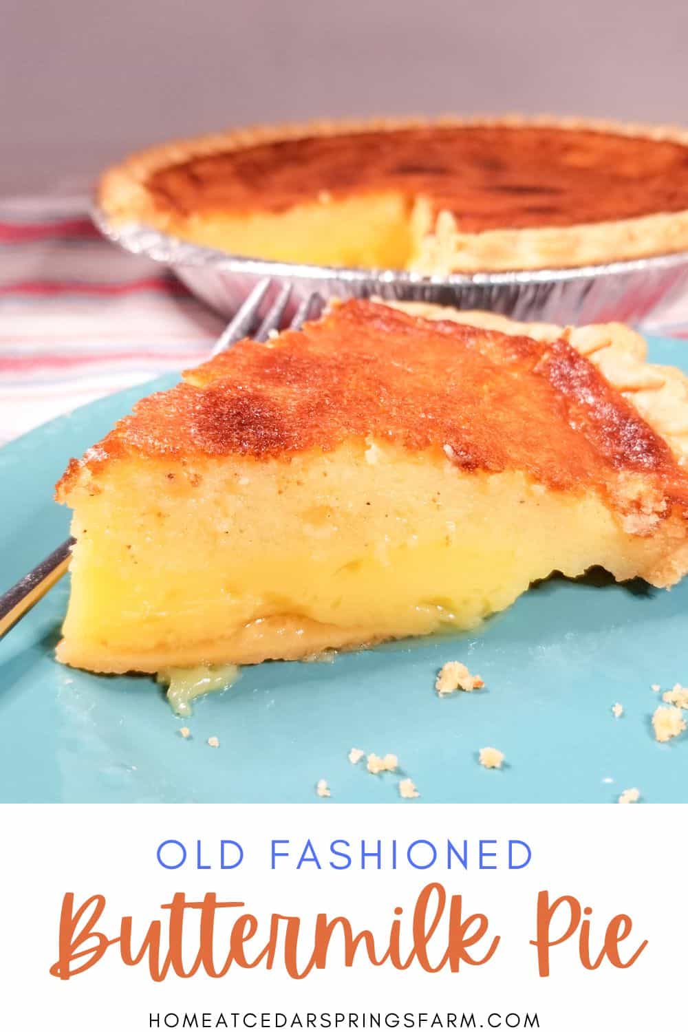 Slice of southern buttermilk pie on a blue plate with rest of pie in the background.