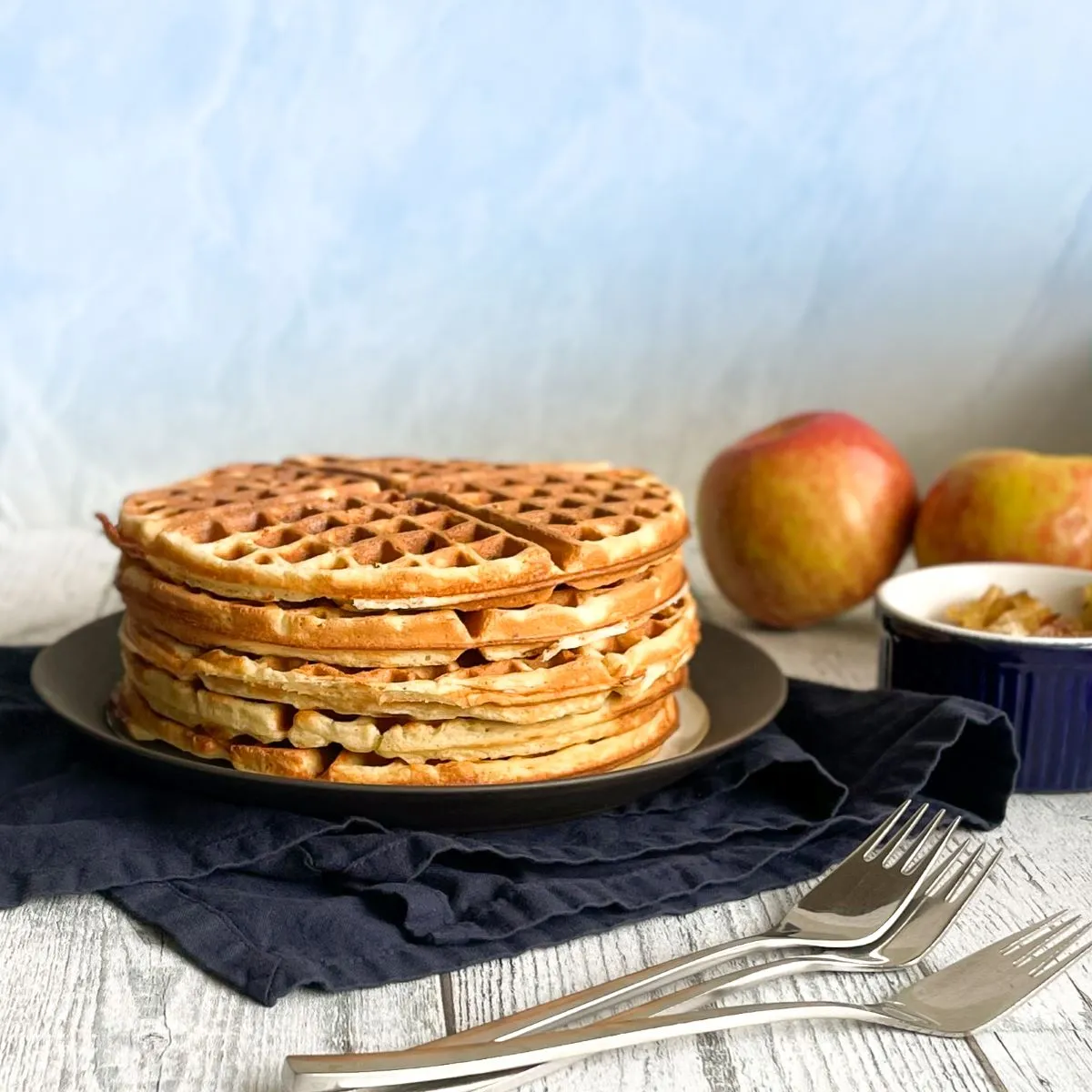 Stack of caramelized onion and apple waffles.