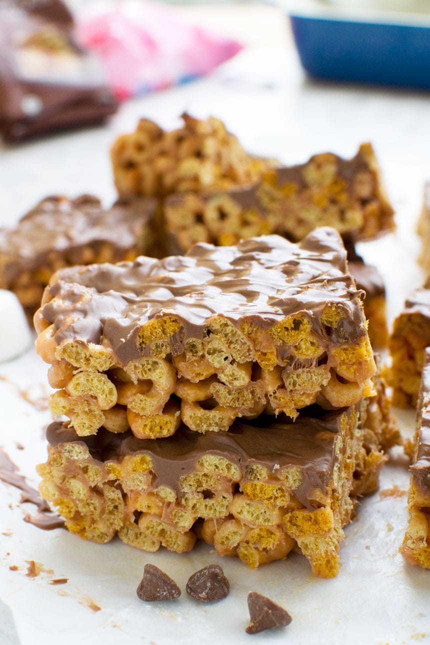 Stack of chocolate covered peanut butter cheerio bars.