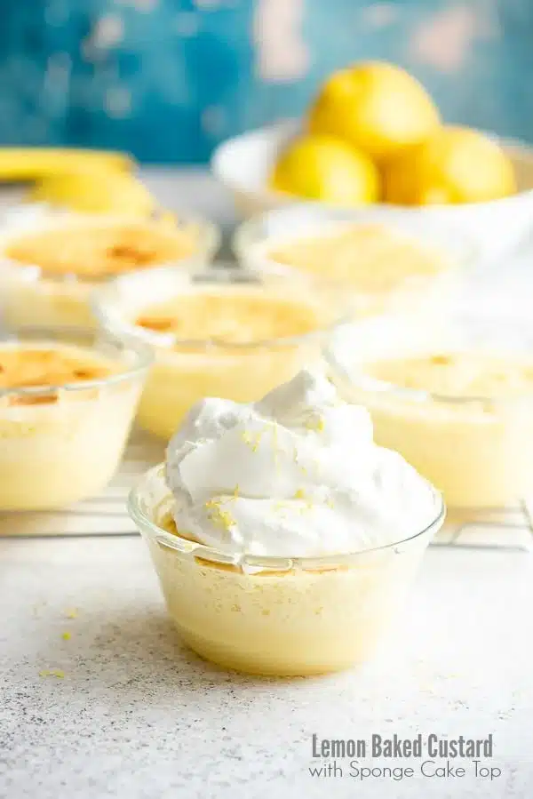 Lemon baked custard with sponge cake top in individual glass serving dishes.