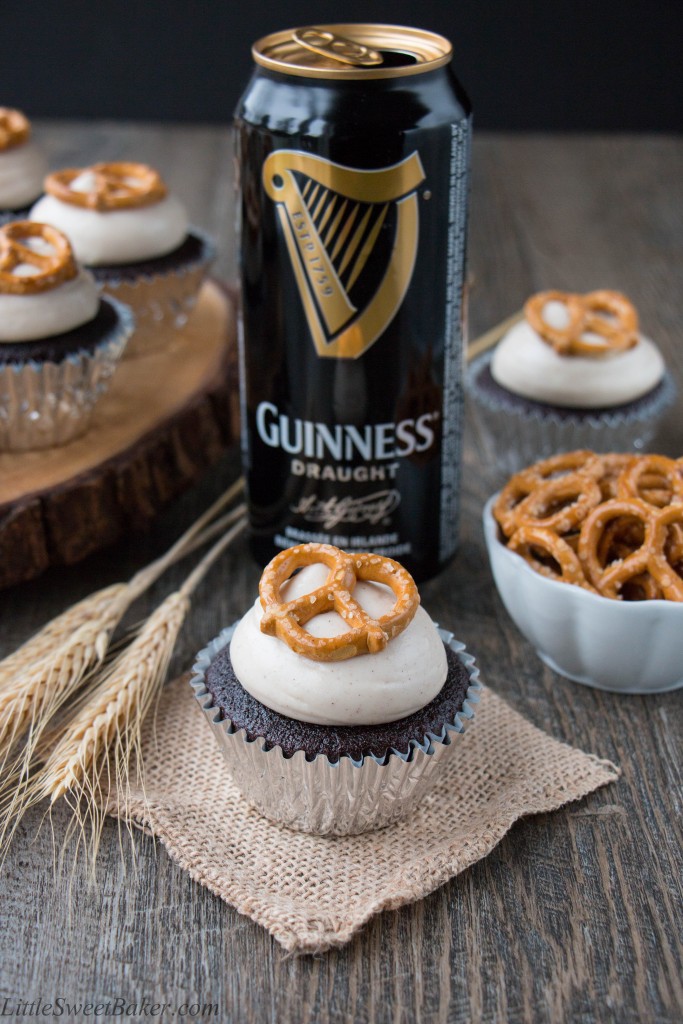 Chocolate Guinness cupcakes with bottle in background.