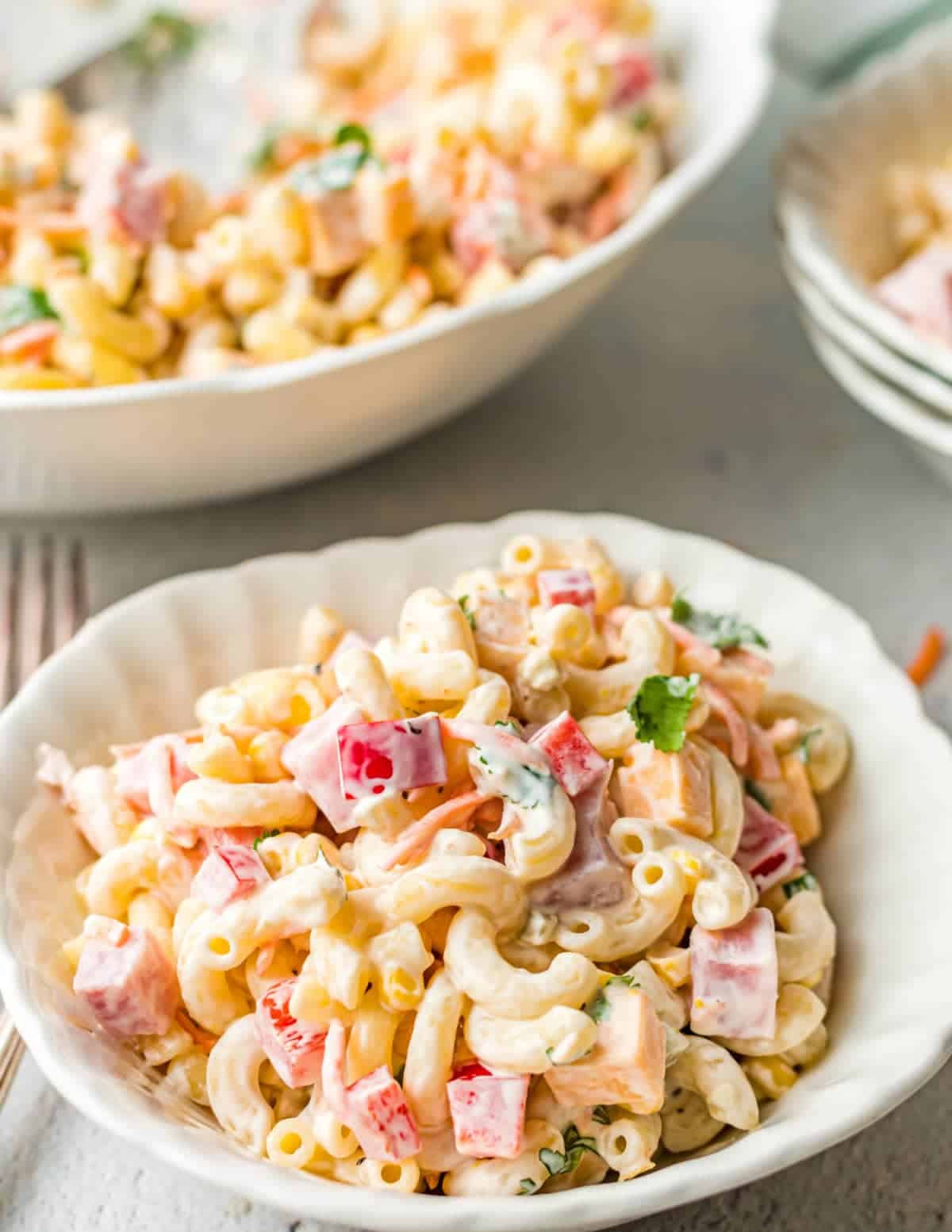 Mexican ham pasta salad in a white bowl.