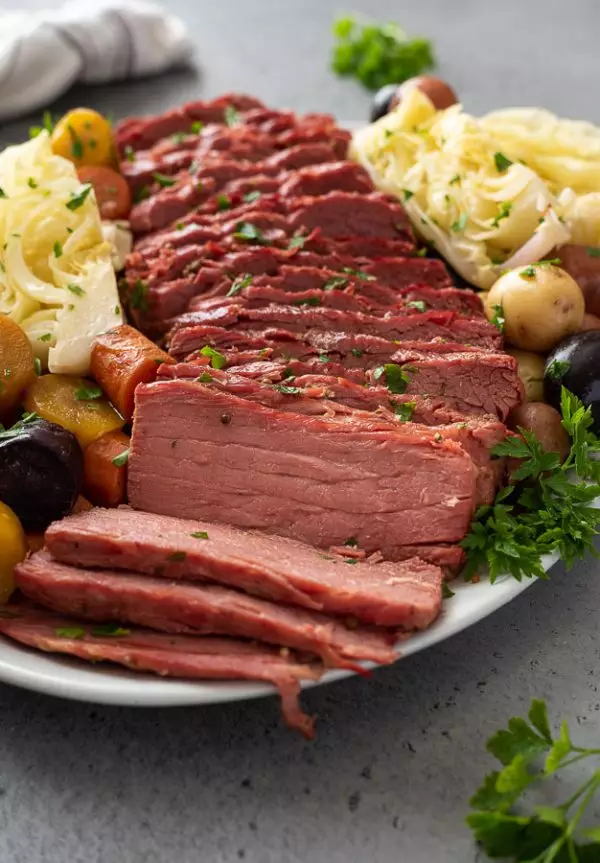Corned beef and cabbage on a serving platter.