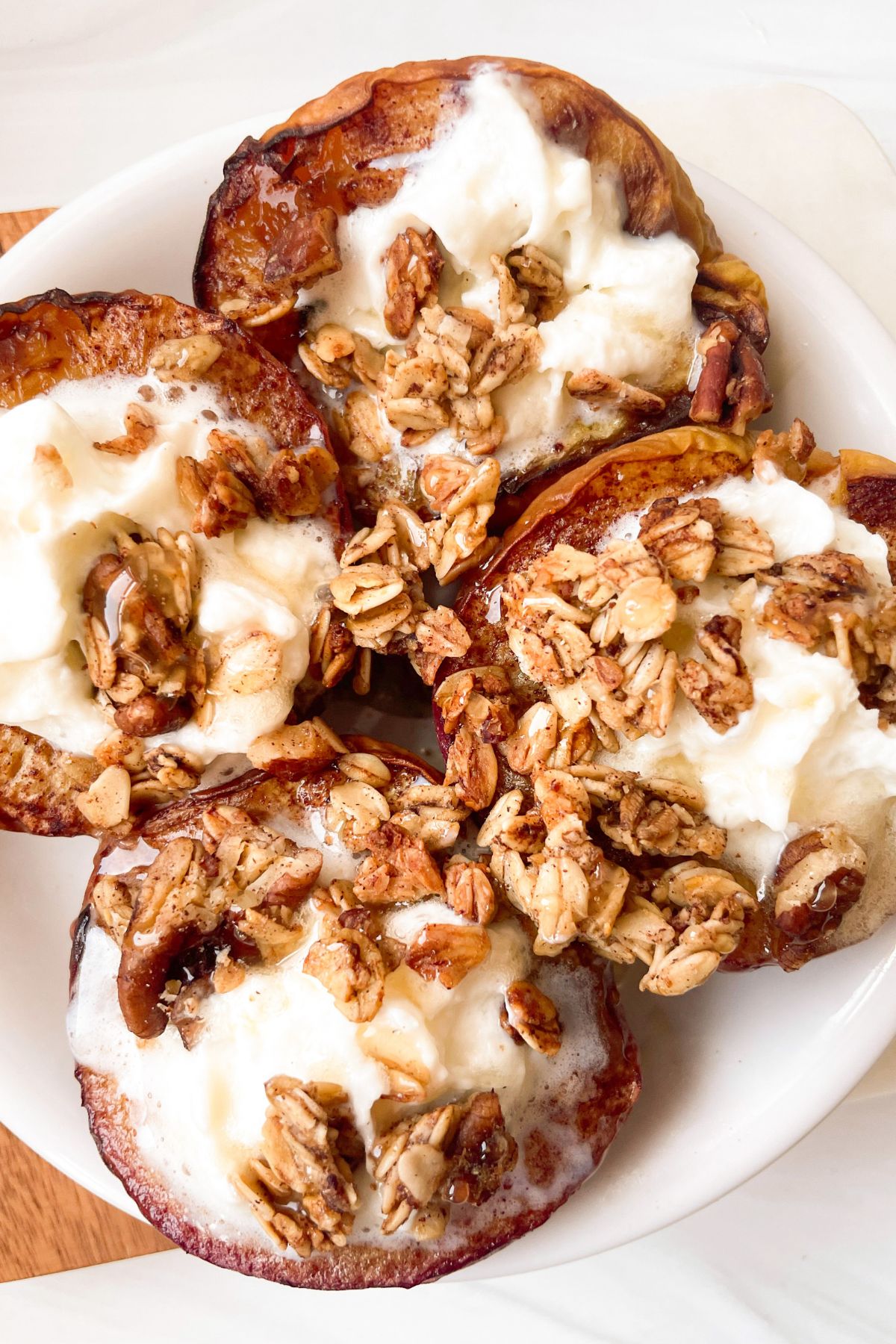 Air fryer peaches on white plates.