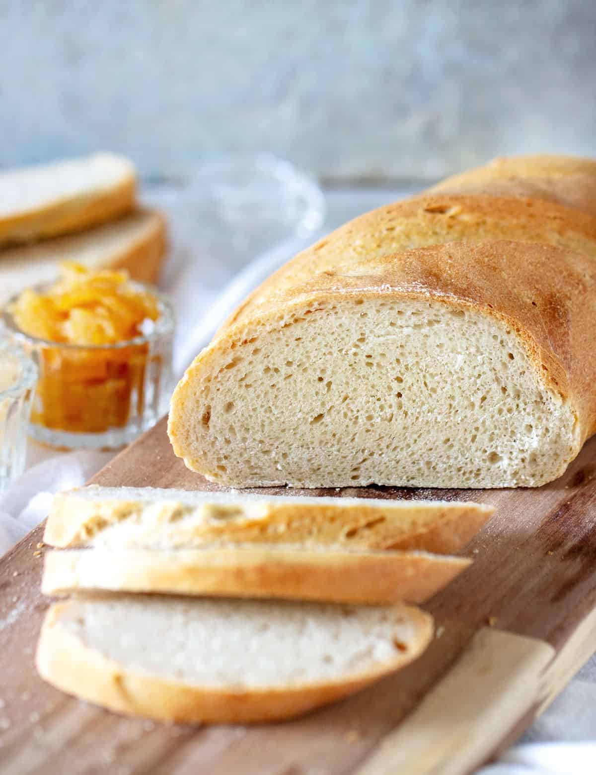 Semolina bread on a wooden cutting board.