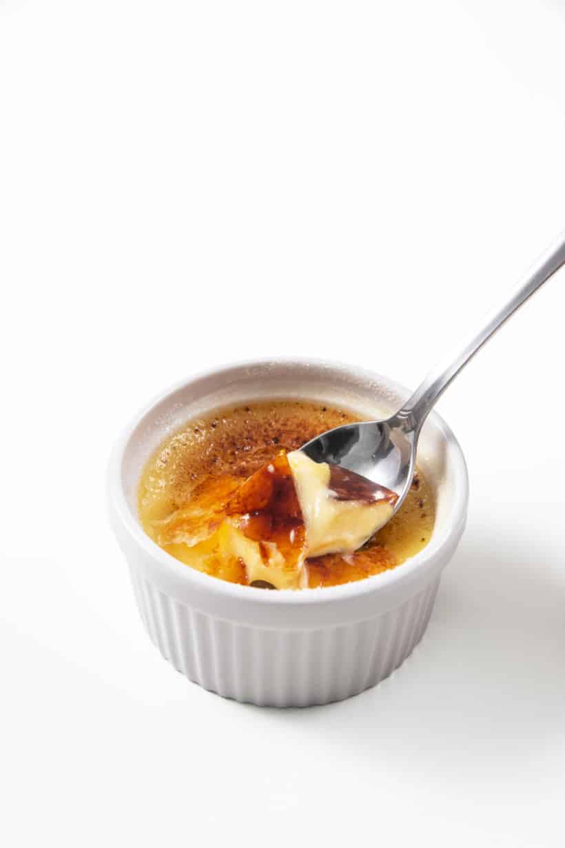 Instant pot cream brulee with spoon.