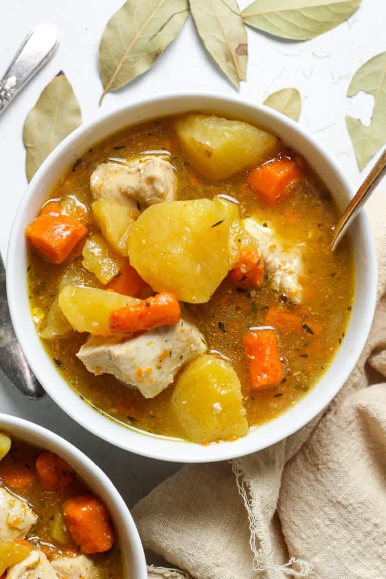 Instant pot chicken stew in a white bowl.