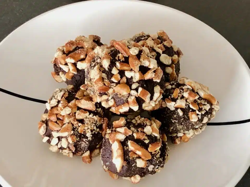 Guinness pretzel truffles in a white bowl.