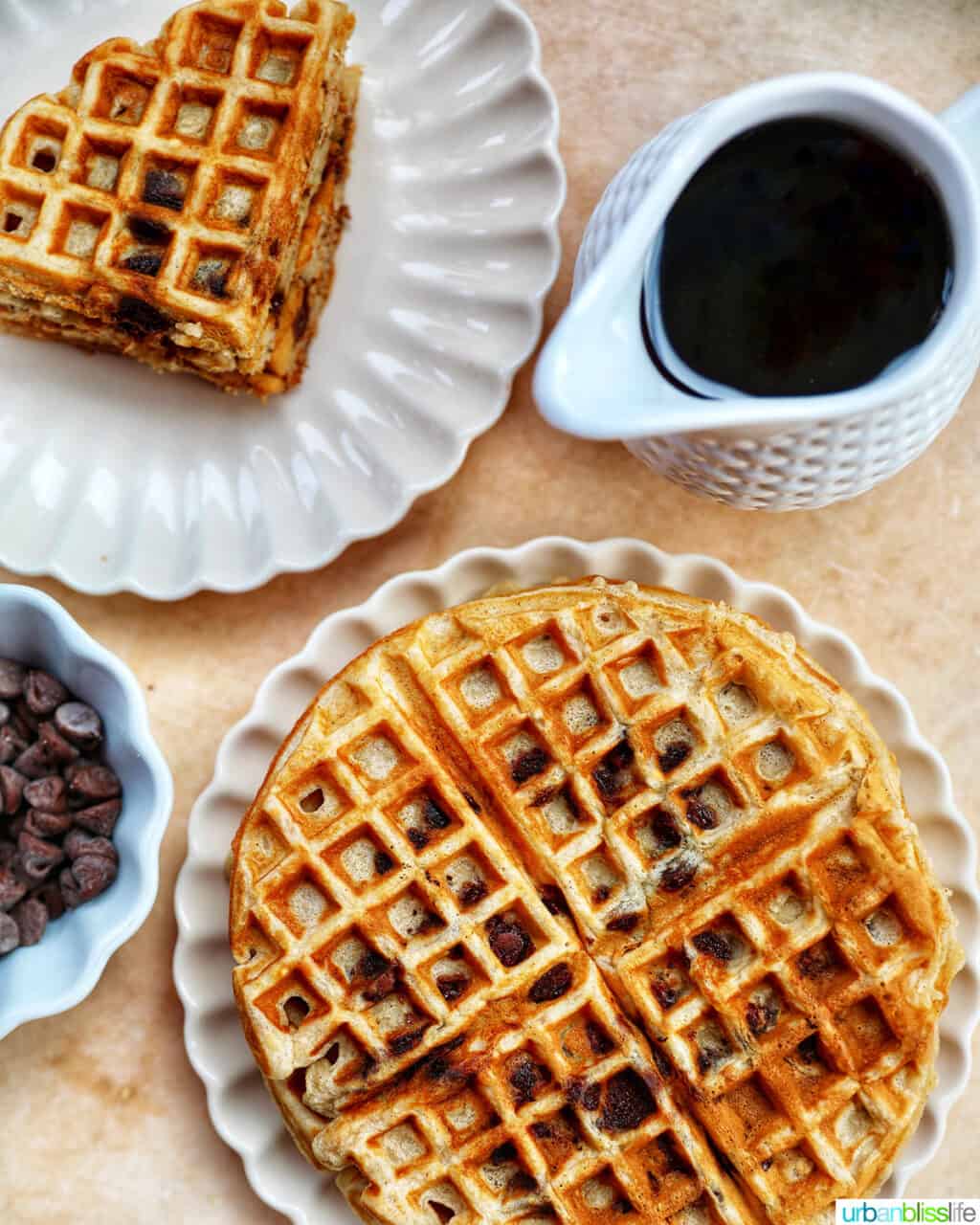 Stack of banana chocolate chip waffles with syrup.