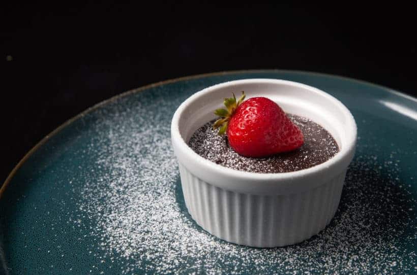 Instant pot chocolate lava cake on a blue plate.