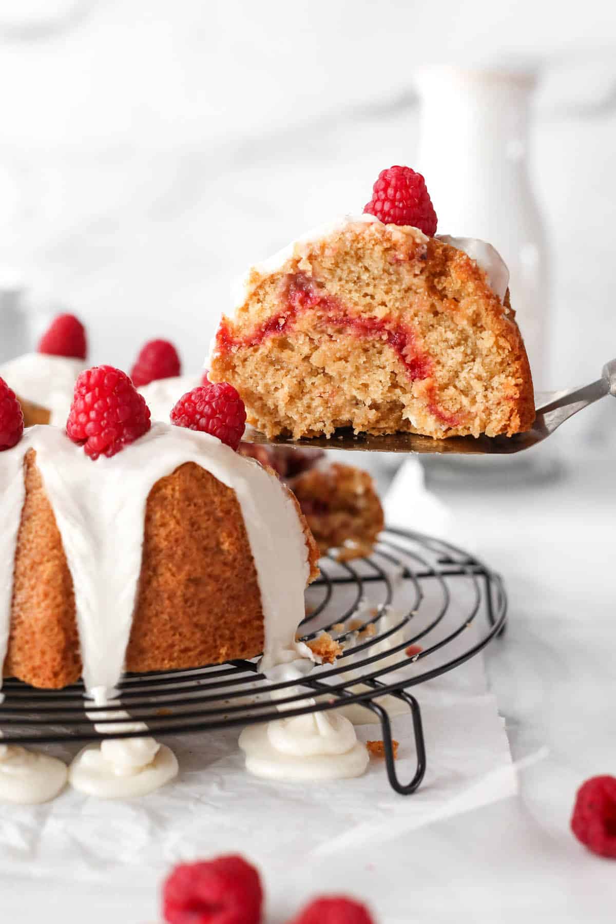 Slice of raspberry white chocolate bundt cake.