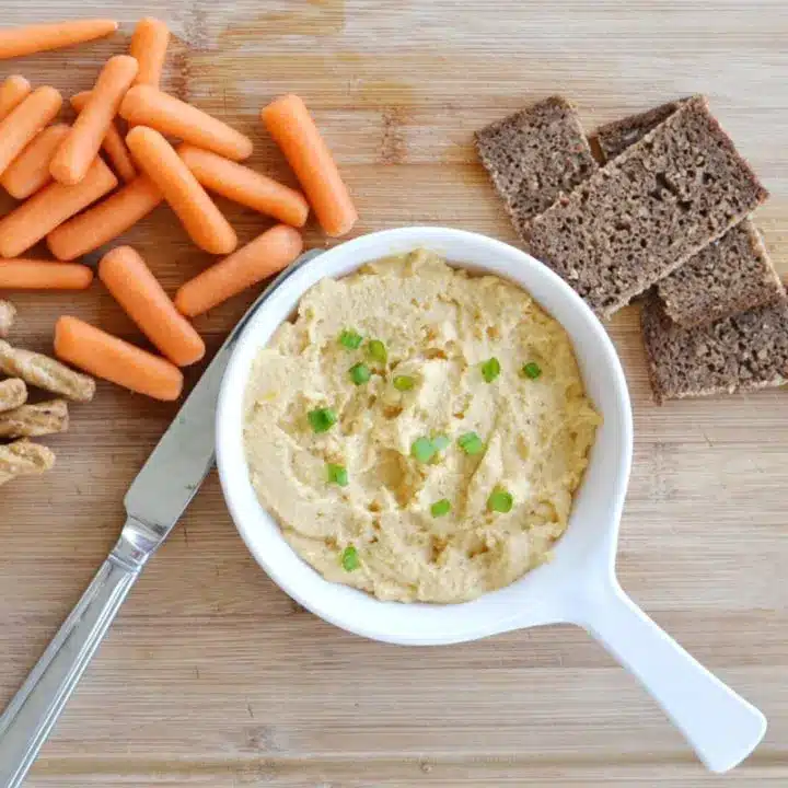 Irish pub cheese spread with Guinness with carrots and bread.