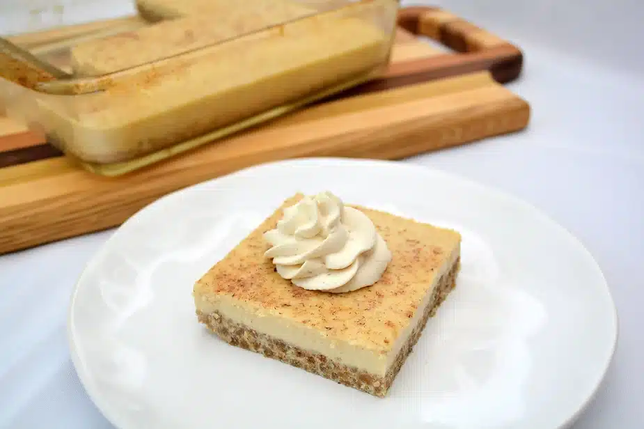 Grape-nut custard pudding with maple whipped cream.