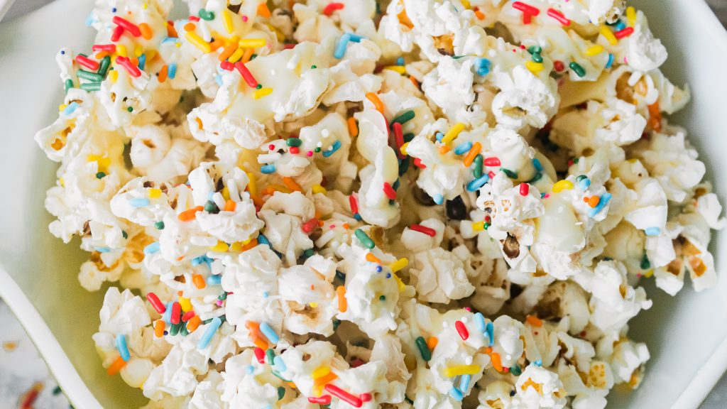 Confetti popcorn in a white bowl.