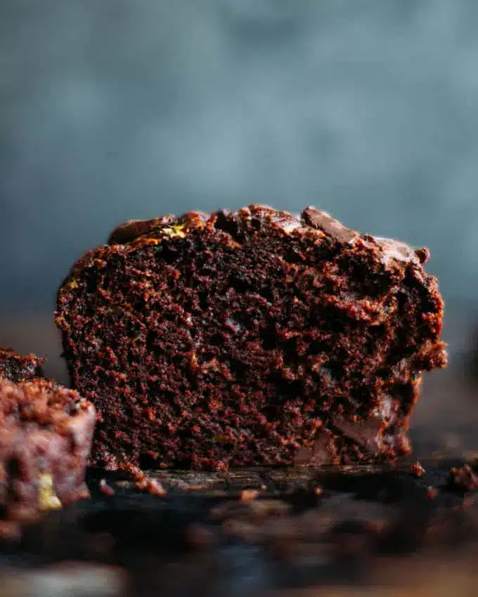 Chocolate zucchini bread on a dark surface.