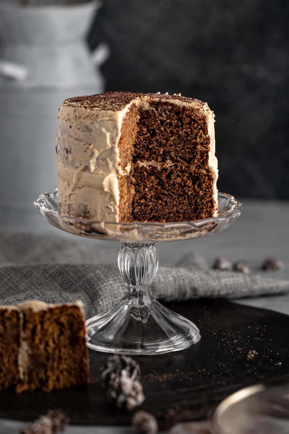 Mini layer cake on a clear glass stand.