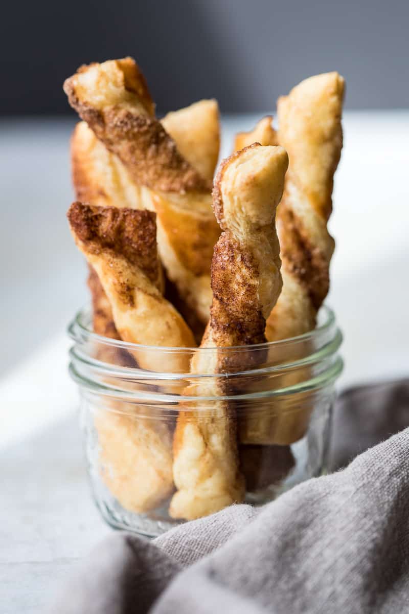 Puff pastry cinnamon twist in a small mason jar.